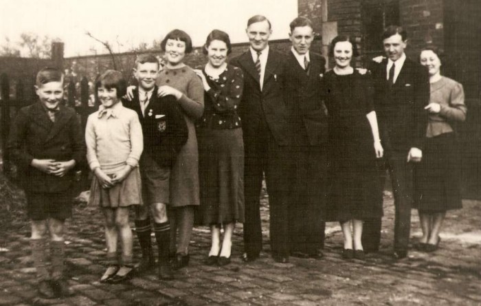 03. Tom, 4th from the right with his 9 brothers and sisters in order of birth, 1935